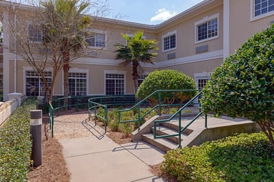 Outdoor walkway leading to the facility entrance