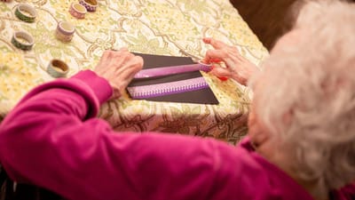 Senior resident engaging in a craft activity