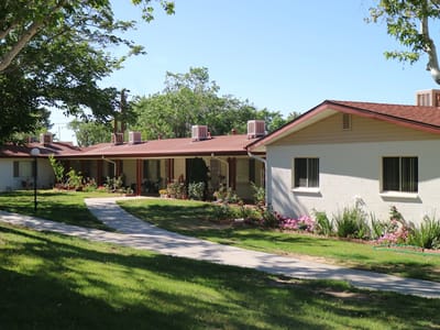 Pathway leading to residential living units with gardens