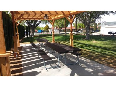 Outdoor picnic area with shaded tables