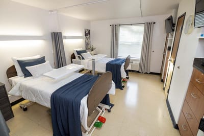 Bright shared resident room with two beds