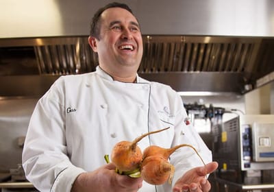 Chef presenting fresh vegetables in the kitchen
