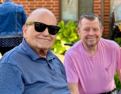 Two residents enjoying time outdoors in sunny weather