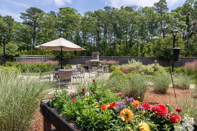 Beautifully landscaped outdoor area with seating and flowers