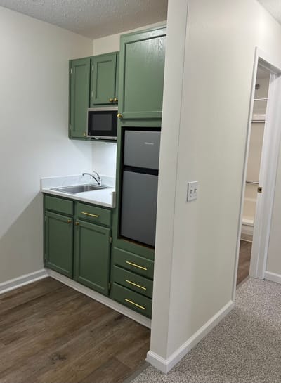 Interior view of a small kitchenette in a resident room