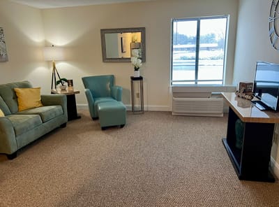 Comfortable seating area in a senior living unit