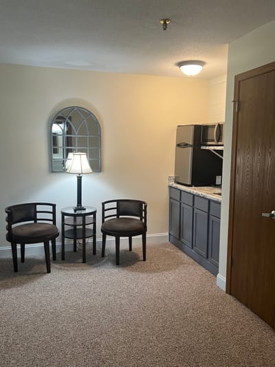 Cozy interior of a resident room with seating area