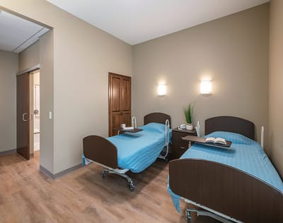Interior view of a shared resident room with two beds