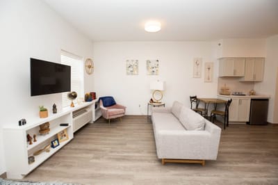 Bright interior of a resident room with furniture