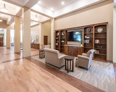 Interior common area with seating and bookshelves
