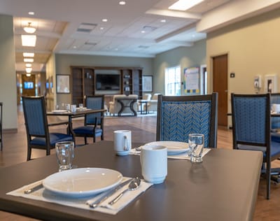 Dining room setting with tables and chairs ready for meals