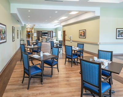 Bright dining area with tables and chairs