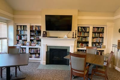 Cozy common area with bookshelves and seating