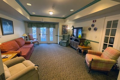 Bright common area with seating and natural light