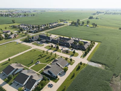 Aerial view of a senior living community with green spaces