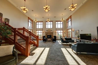 Interior common area with comfortable seating and large windows