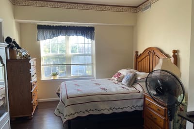 Cozy private resident room with a bed and decor