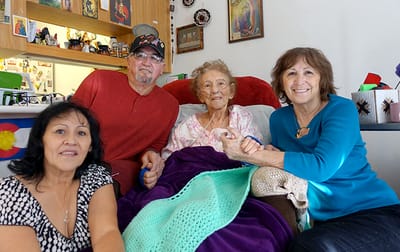 Residents and staff together in a cozy interior setting