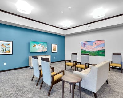 Interior view of a common area with seating and artwork