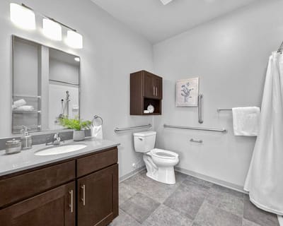 Bright and clean bathroom with safety features