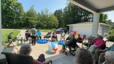 Residents enjoying an outdoor activity with water and games