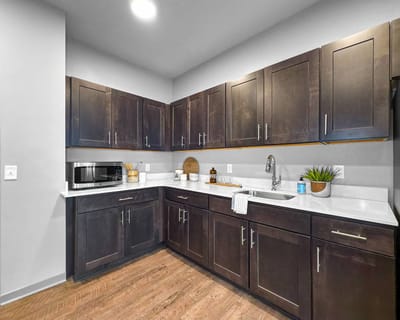 Spacious kitchen area with modern cabinets and appliances