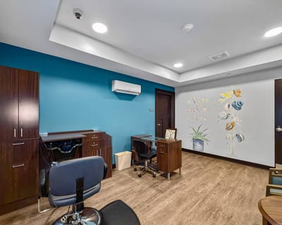 Bright interior of a resident room with decorative wall art