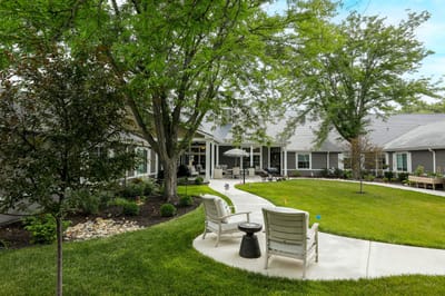 Lush garden area with seating and pathways