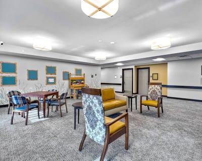 Bright common area with seating and art decor
