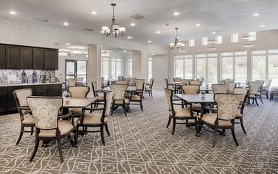 Dining area with tables and chairs for residents