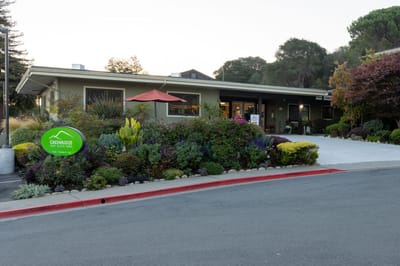 Exterior view of Greenridge Assisted Living facility with landscaping