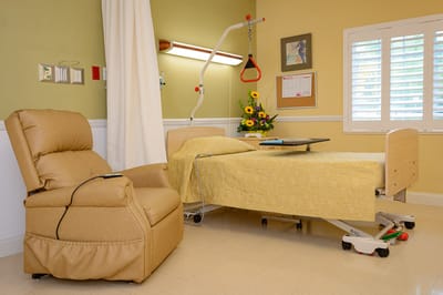 Cozy private room with bed and recliner
