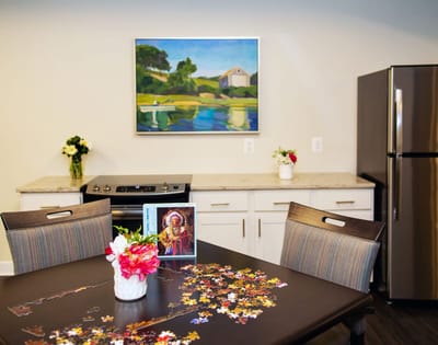 Activity table with puzzle pieces in a common area