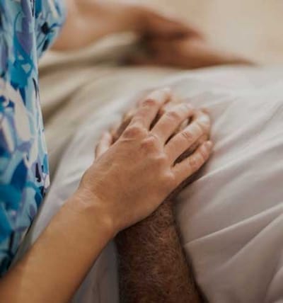 Lorien Bulle Rock, Nursing Home in Havre De Grace, MD — Caregiver's hand on a patient's arm