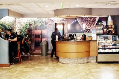 Interior view of a cafe area with staff and residents
