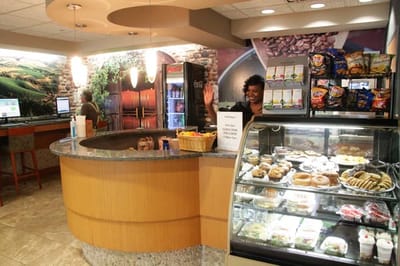 A vibrant café area with staff and food options