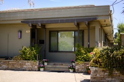 Exterior view of the Maple House entrance with landscaping