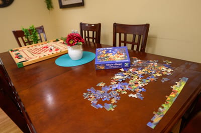 Puzzle activity set up on a dining table