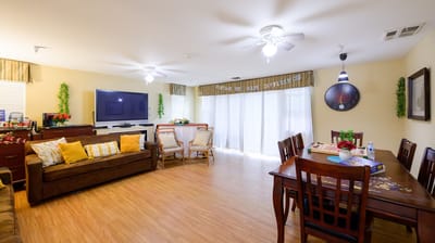 Bright common area with seating and table games