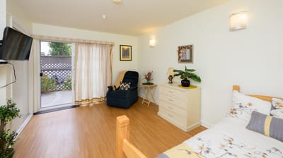 Cozy interior view of a resident room with outdoor access