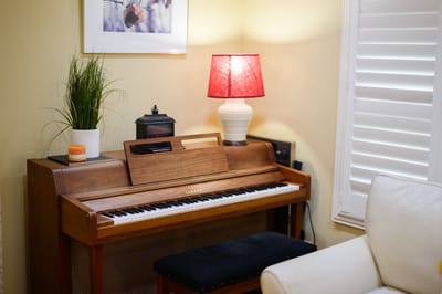 Piano and lamp in a cozy lounge area