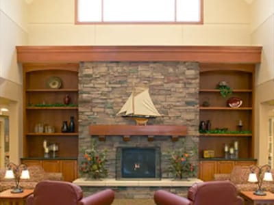 Cozy interior of a common area with stone fireplace