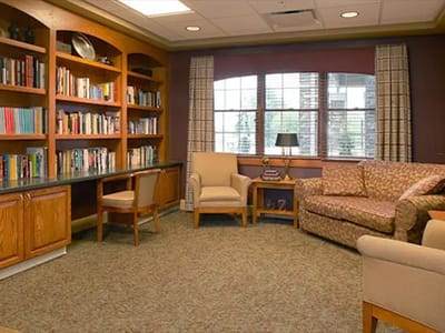 Cozy common area with bookshelves and seating