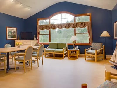Bright common area with seating and dining table