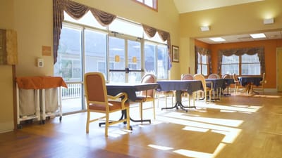 Dining area with natural light and seating arrangements