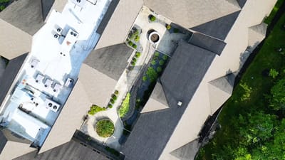 Aerial view of the facility with garden areas.