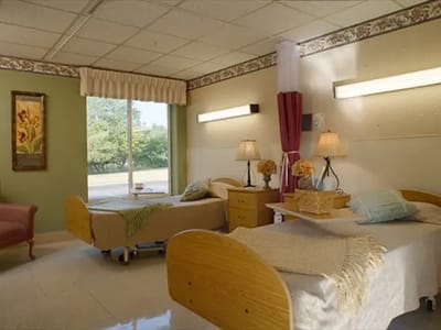 A cozy shared room with two beds and natural light