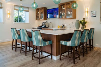 Bright common area with a stylish bar and seating