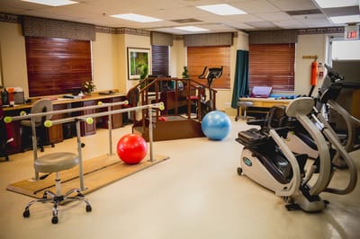 Interior of a rehabilitation area with equipment and exercise aids