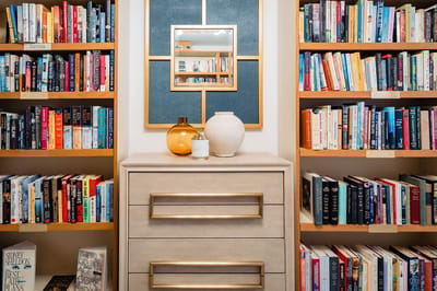 Cozy library corner with bookshelves and decor